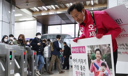 A candidate from the main opposition United Future party at a subway station in Seoul.