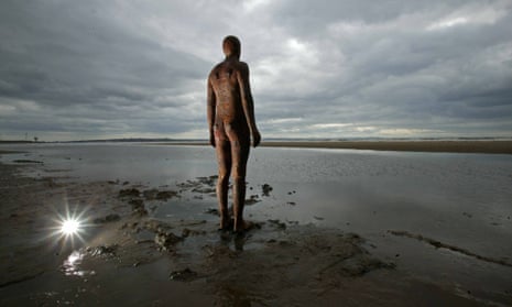 One of the figures in Antony Gormley's Another Place installation