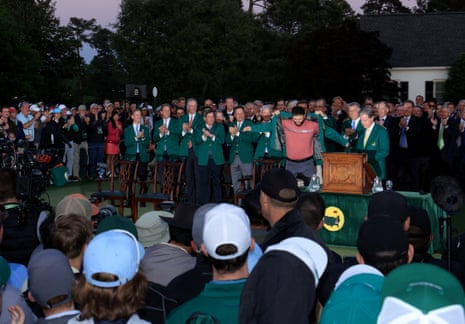 Jon Rahm is presented with his green jacket.