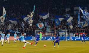 Schalke fans applaud on their side.