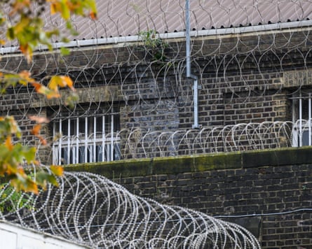 general view of security measures and barbed wire fencing surrounding HMP Pentonville