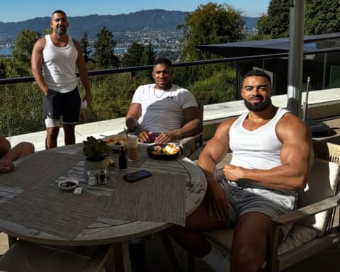 Kevin ‘Lateef’ Ayodele (right) and Sina Ghami (left), who both died in the crash, are pictured alongside Anthony Joshua.