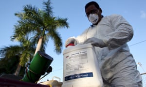 A health worker prepares insecticide before fumigating a neighborhood in San Juan on 27 January 2016.