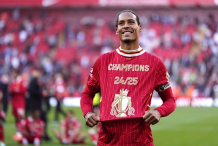 Virgil van Dijk on the pitch after Liverpool had won the title