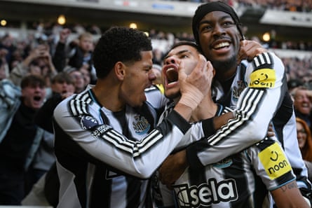 Bruno Guimaraes celebrates with teammates.
