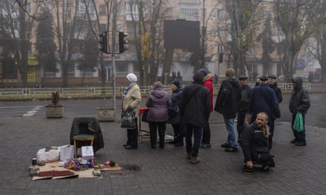 Residents queue to get cellphone SIM cards in downtown Kherson.