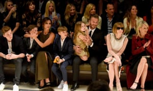 Victoria Beckham at a Burberry show in Los Angeles in April with her family. From left, Brooklyn, Cruz, Romeo, Harper, David, and the editor-in-chief of Vogue, Anna Wintour.