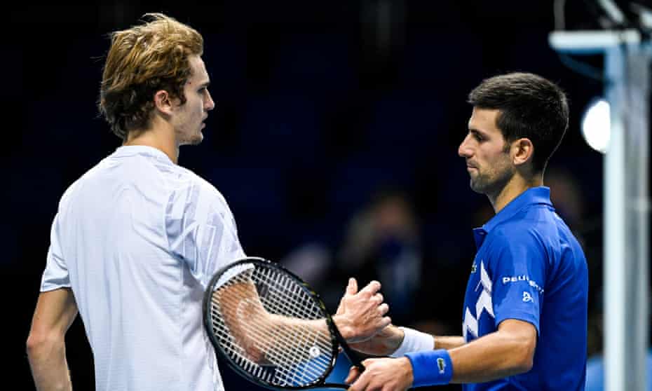 Novak Djokovic (right) shakes hands with Alexander Zverev after their round-robin ATP Finals match.