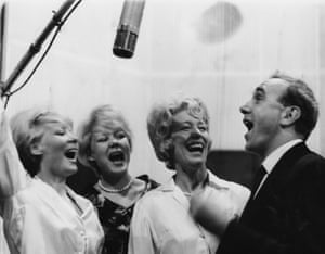 Billy Wright singing with the group ‘The Beverley Sisters, (left to right) Babs, Teddy and his wife Joy.