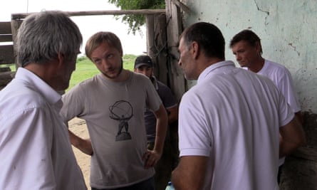 Alexey confronts a farm foreman over the liberation of a worker
