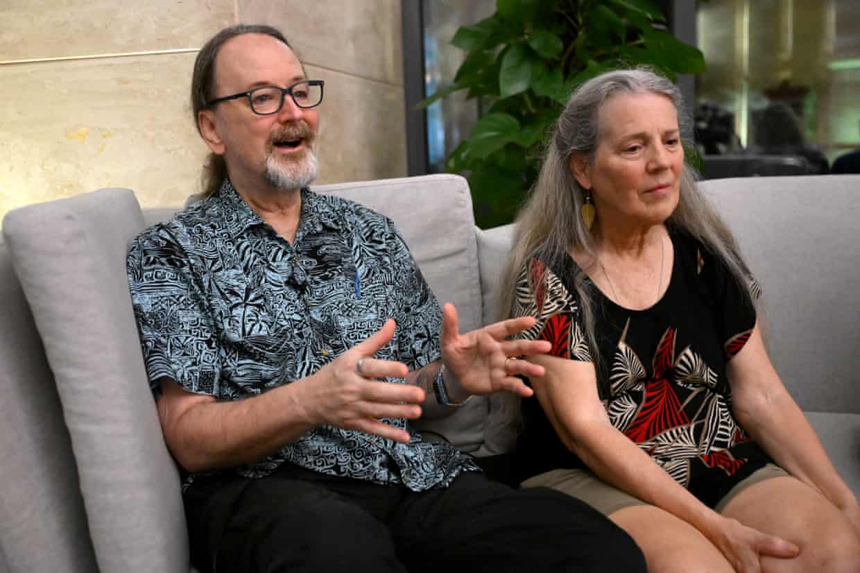 Cruise ship passengers Randy and Kit Cassingham sit on a sofa during an interview