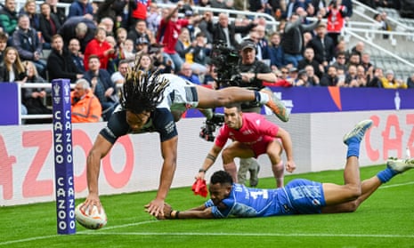Dom Young dives over to score his second and England’s third try against Samoa.