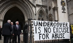 Undercover Policing Inquiry Opens<br>LONDON, ENGLAND - JULY 28: Campaigners attach a banner to the entrance of The High Court on July 28, 2015 in London, England. A public inquiry has opened into the use of under cover police in England and Wales. Inquiry Chairman Lord Justice Pitchford has said he intends to look at operational governance and oversight of undercover policing. (Photo by Peter Macdiarmid/Getty Images)