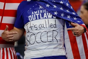 A USA fan prior tries to rile England fans with a t=shirt saying “It’’s called soccer”.