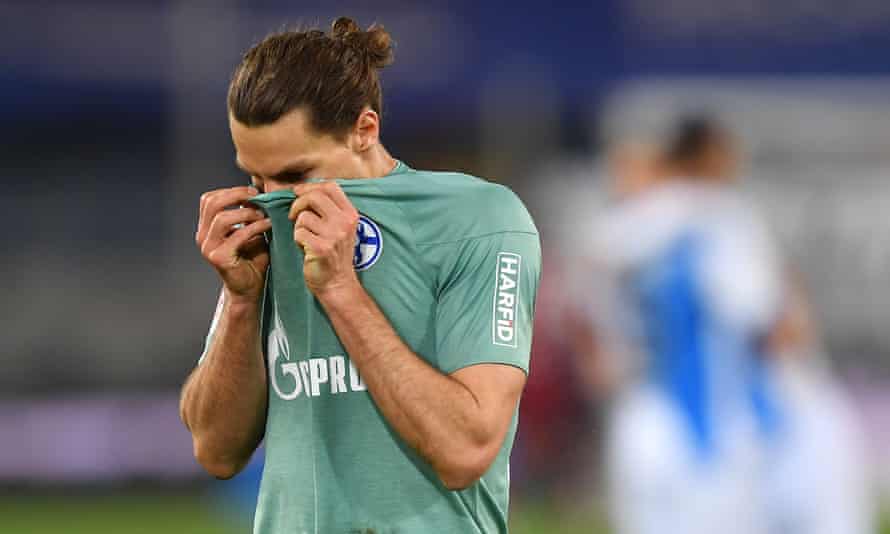 Schalke’s Benjamin Stambouli reacts at full time to the confirmation of relegation