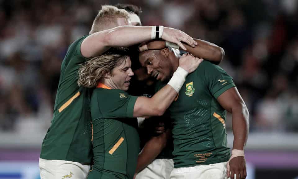 South Africa’s Makazole Mapimpi celebrates scoring the first try in the final with Faf de Klerk.
