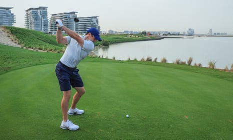 Rory McIlroy plays a shot during a pro-am event at Yas Links golf course in Abu Dhabi.