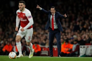 Arsenal manager Unai Emery urges his players forward as Sead Kolasinac carries the ball.