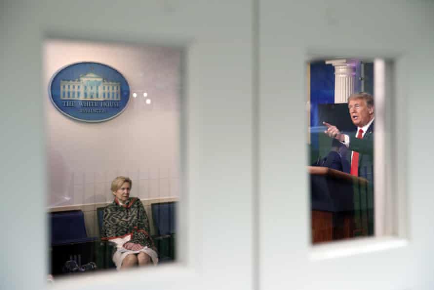 Donald Trump holds a press conference about the coronavirus at the White House on 13 April 2020 as Dr Deborah Birx listens.