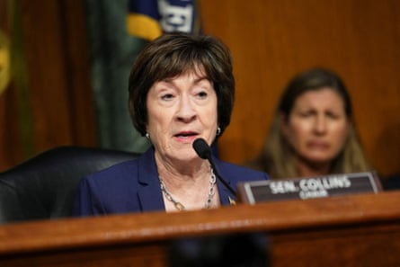 A older woman speaks into a microphone