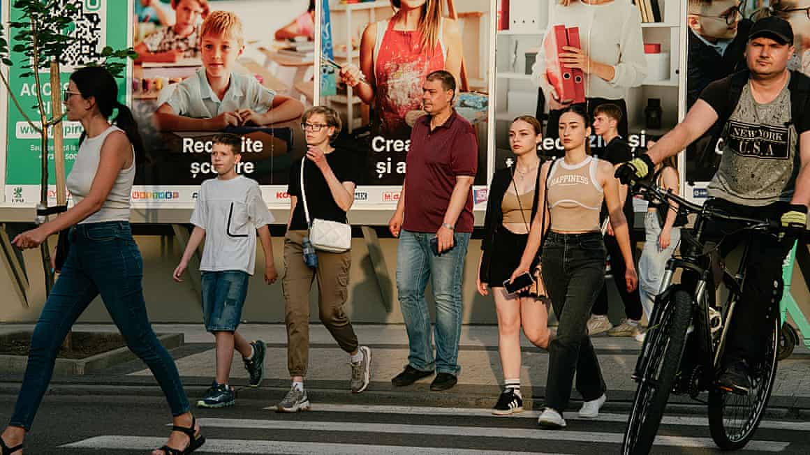 Pedestrians cross a street