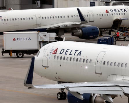 Delta Airline planes on a runway next to one another