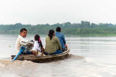 Mari Luz Canaquiri Murayari out on the river with members of her community