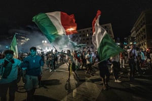 Fans of the Italian football team celebrate in Rome after Italy’s victory against England in the Euro 2020 final