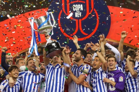 Real Sociedad’s players celebrate with the trophy after winning the Copa del Rey in 2021