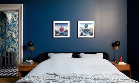 A bedroom with dark blue walls