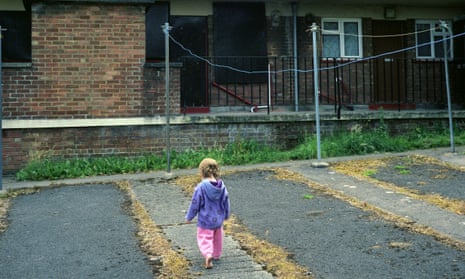 Child plays near housing estate