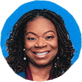 woman smiling against blue background