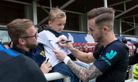 James Maddison signs autographs for supporters after training with England