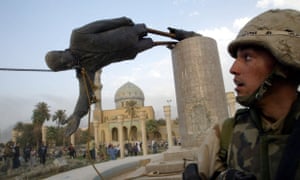 Photo: REUTERS/Goran Tomasevic A U.S. soldier watches a statue of President Saddam Hussein fall in Central Baghdad