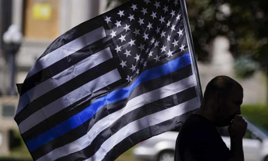 A thin blue line carried at a Blue Lives Matter rally in Kenosha, Wisconsin, 30 August 2020.