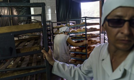 Loaves of bread are packaged for delivery at a bakery in Kostiantynivka.