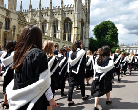 Cambridge University students pass King's College on graduation day