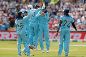 Mark Wood of England (Bowled) and Joe Root (caught) commemorate the dismissal of Isuru Udana of Sri Lanka