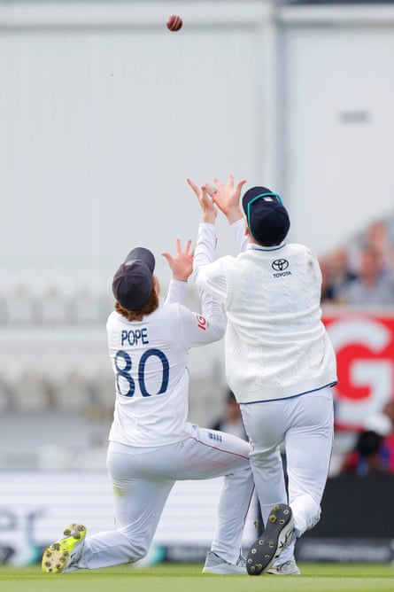 England's Zak Crawley (right) and Ollie Pope get tangled as Crawley catches out India's Washington Sundar.