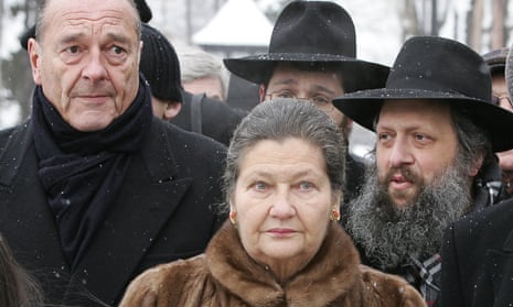 Simone Veil with President Jacques Chirac, left, in 2005, visiting the former Auschwitz death camp where she had been held in 1944, to mark the 60th anniversary of the liberation of Auschwitz-Birkenau.
