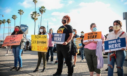 People hold signs during a rally in support of the Supreme Court’s ruling in favor of the Deferred Action for Childhood Arrivals (Daca) program, in San Diego, California, on 18 June.