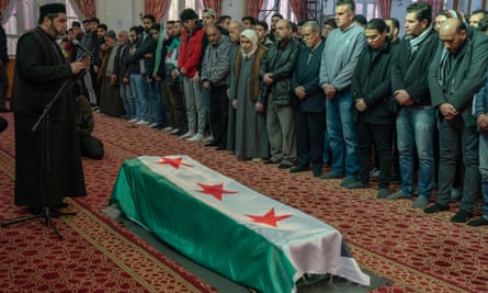 Mourners gather for the funeral ceremony of Mazen al-Hamada