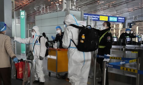 health workers at an airport in China