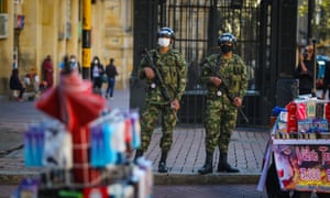 Colombian soldiers wear protective face masks in Bogota.