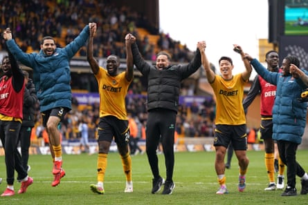 Vítor Pereira and his players celebrate after the win over Tottenham at Molineux in April