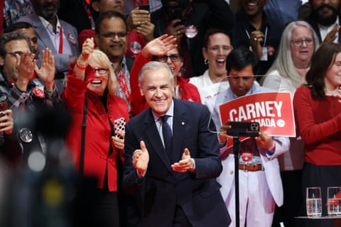 Crowd surrounding man in suit clapping