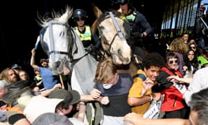 Demonstrators clash with police during a protest against the International Mining and Resources Conference at Melbourne Exhibition and Convention Centre on Tuesday.