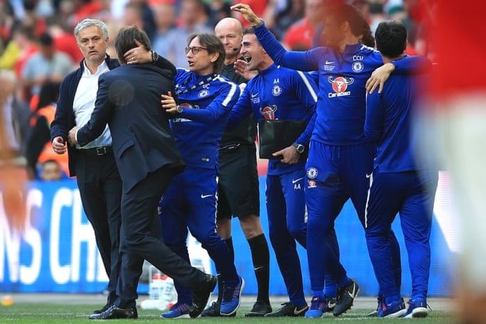 Jose Mourinho and Antonio Conte embrace after the match.