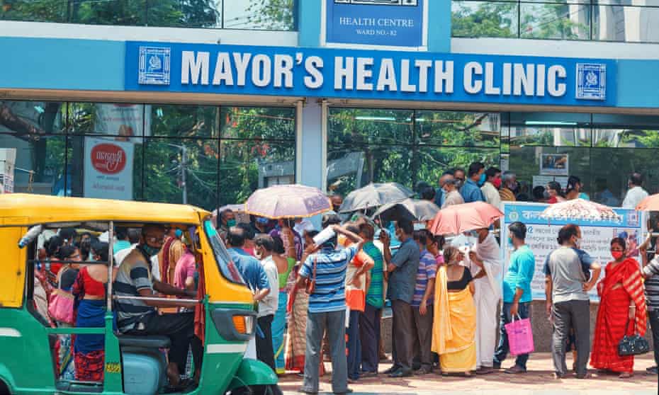 People queue outside a Covid-19 vaccination centre in Kolkata on 24 April