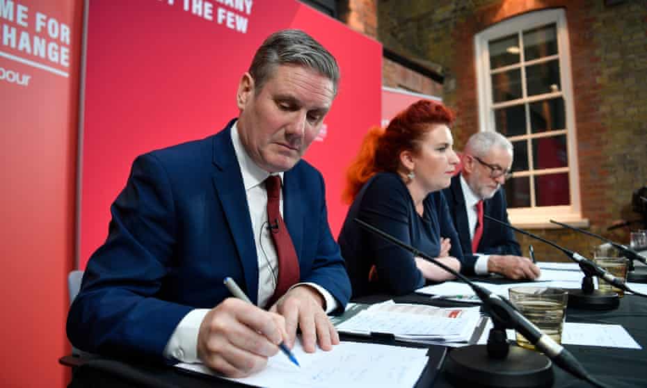 Sir Keir Starmer (left) at a Labour press conference during the general election, with Louise Haig and Jeremy Corbyn. A poll of members suggests he is favourite for next Labour leader.